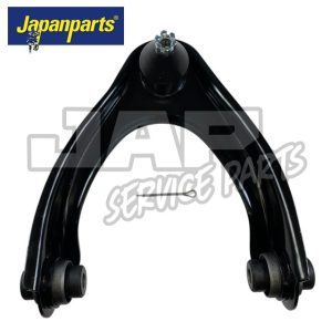 A black automotive control arm with bush bushes on each end and a ball joint at the top, displayed on a white background. The Japanparts logo appears in the top left corner. | Jap Service Parts - Car Parts