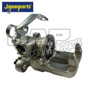 A metallic car brake calliper with a bracket and spring, displayed on a white background. The Japanparts logo is in the top left corner. The calliper appears new and unused. | Jap Service Parts - Car Parts