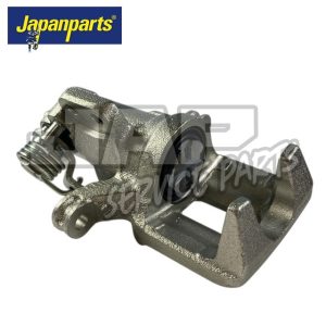 A silver automotive brake calliper with a visible spring, shown on a white background. The Japanparts logo is displayed in the top left-hand corner. | Jap Service Parts - Car Parts