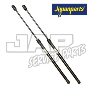 Two black gas struts are shown side by side on a white background with a Japanparts logo in the top right corner and JAP Service Parts watermark behind the struts. | Jap Service Parts - Car Parts