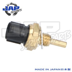A brass and black automotive sensor with a threaded body and electrical connector, isolated on a white background. Blue text in the corner reads MADE IN JAPAN 日本製. | Jap Service Parts - Car Parts