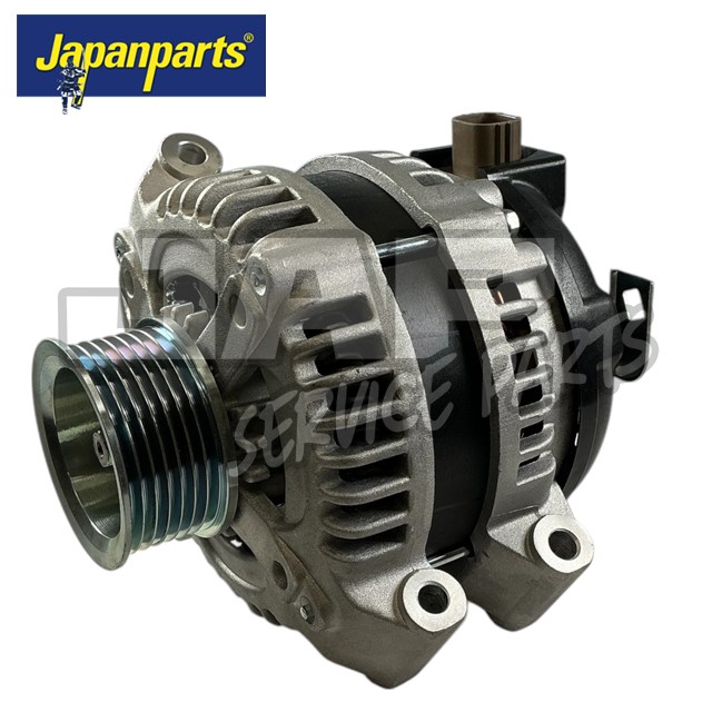 An automotive alternator with a metallic finish is shown close up, featuring visible vents and a pulley. The Japanparts logo appears in the top left corner of the image. | Jap Service Parts - Car Parts