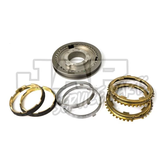 A set of automotive transmission synchroniser rings and components, including metallic and brass-coloured rings, displayed on a white background. | Jap Service Parts - Car Parts