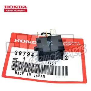 A black Honda relay switch sits on top of a red and white Honda Genuine Parts label showing part number 39794, barcode, and MADE IN JAPAN text. | Jap Service Parts - Car Parts