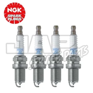 Four NGK spark plugs are lined up vertically against a white background. The NGK Spark Plugs logo appears in the top left corner. The plugs are metallic with white ceramic insulators. | Jap Service Parts - Car Parts